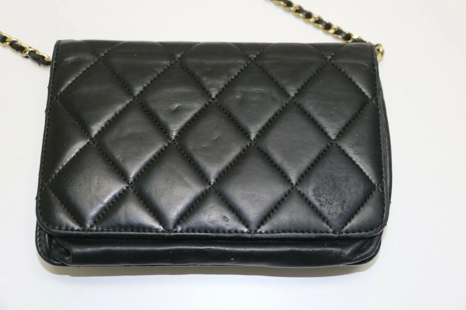 Chanel: Quilted Black Leather Chain Clutch - Flip Lock