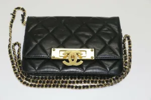 Chanel: Quilted Black Leather Chain Clutch - Flip Lock